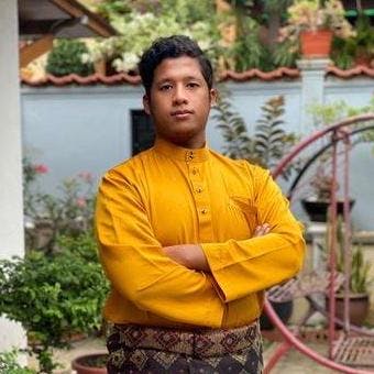 Atif Aiman in a golden Baju Melayu